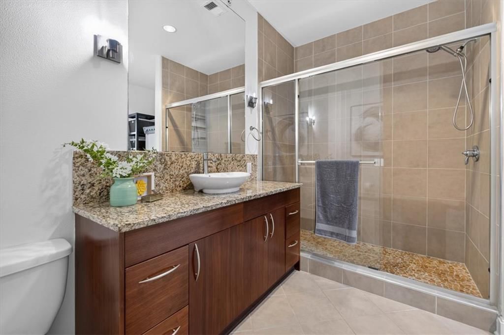 Walk-in shower and tiled shower at 4521 Wornall Road #106, Kansas City, MO 64111