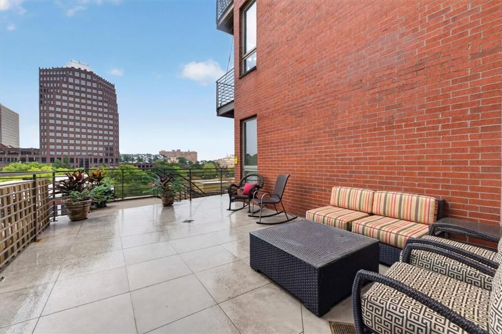 Pergola, fire pit and paver patio at 4521 Wornall Road #106, Kansas City, MO 64111