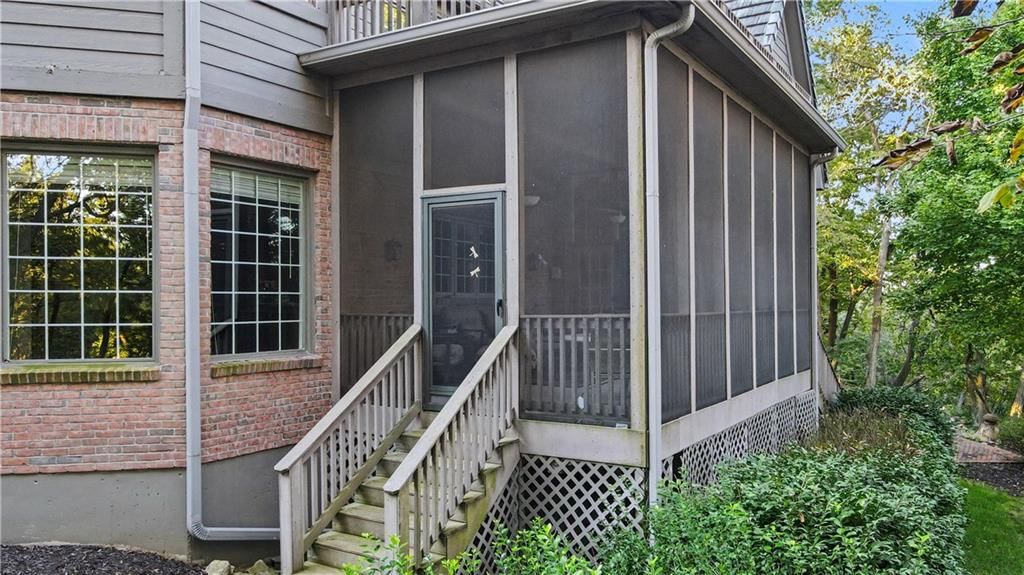 Screened porch at 60 W Dundee Court, Loch Lloyd, MO 64012