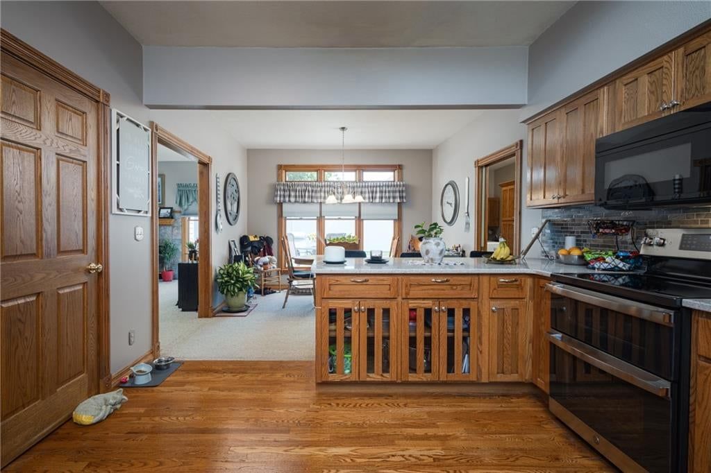 Kitchen island and kitchen backsplash at 2607 Quail Street, Harrisonville, MO 64701