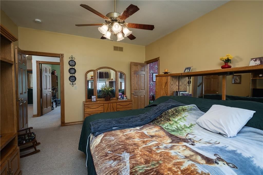 Main-floor primary bedroom at 2607 Quail Street, Harrisonville, MO 64701