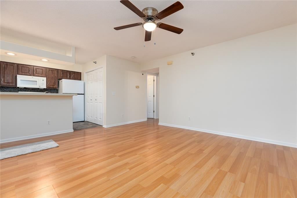 Open floor plan, white trim and white walls at 6966 N Olive Street, Gladstone, MO 64118