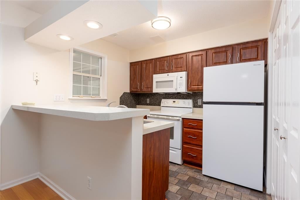 Kitchen backsplash and recessed lighting at 6966 N Olive Street, Gladstone, MO 64118