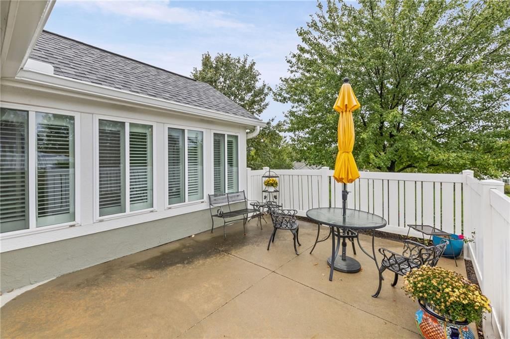 Fenced yard, vinyl fence and concrete patio at 7110 Hedge Lane Terrace, Shawnee, KS 66227