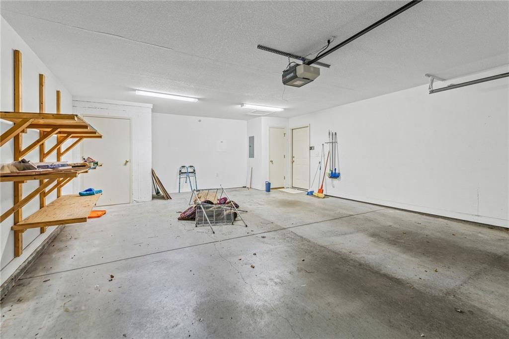 Attached garage and concrete driveway at 7110 Hedge Lane Terrace, Shawnee, KS 66227
