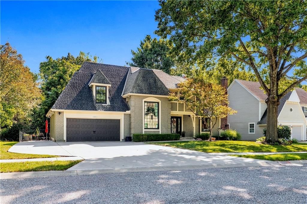 Attached garage and concrete driveway at 13011 W 83rd Terrace, Lenexa, KS 66215