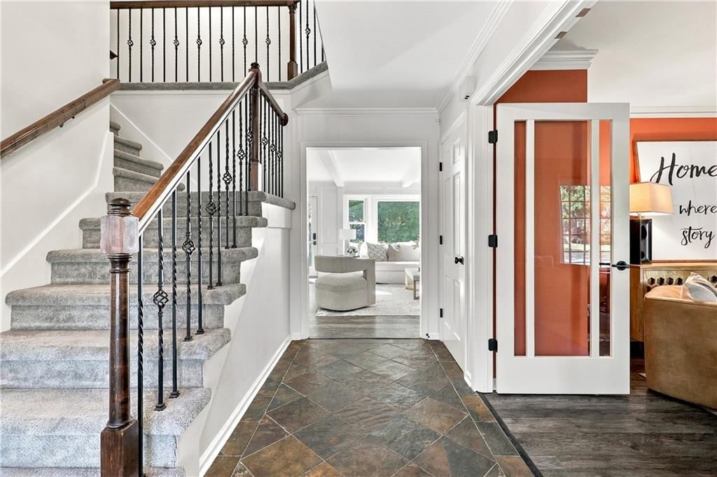 Staircase, iron stair railing and black hardware at 13011 W 83rd Terrace, Lenexa, KS 66215