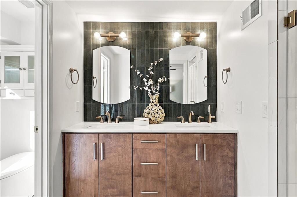 Double vanity and wood vanity at 13011 W 83rd Terrace, Lenexa, KS 66215