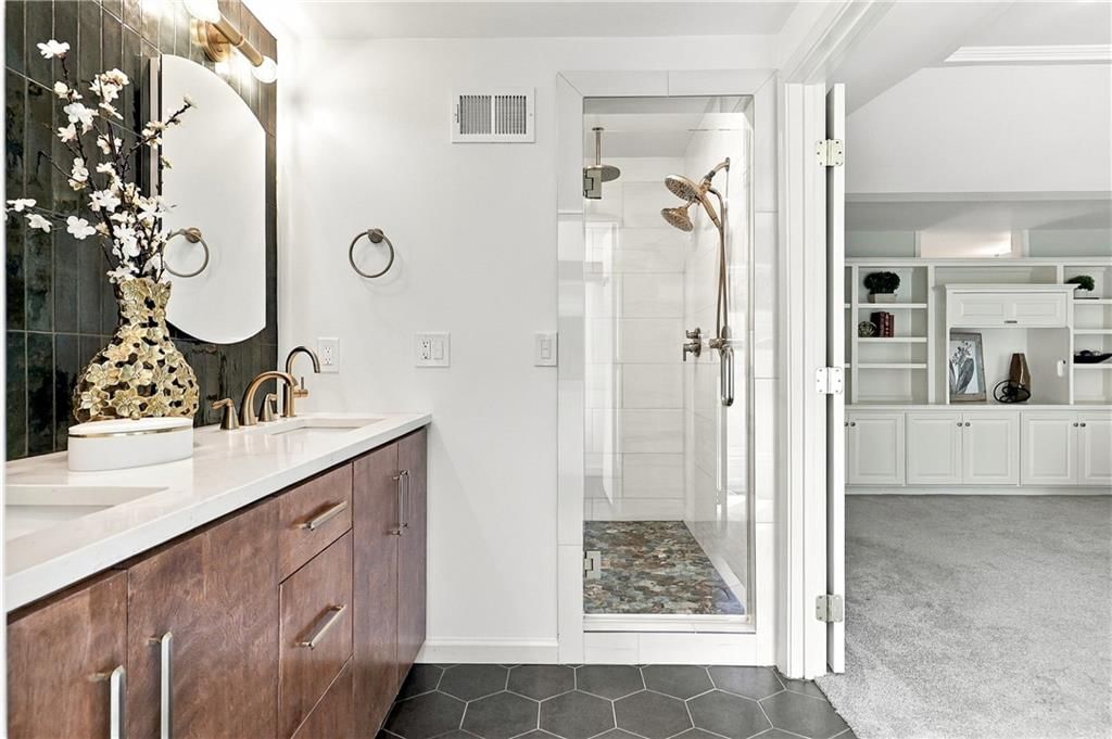 Walk-in shower, tiled shower and frameless glass shower at 13011 W 83rd Terrace, Lenexa, KS 66215
