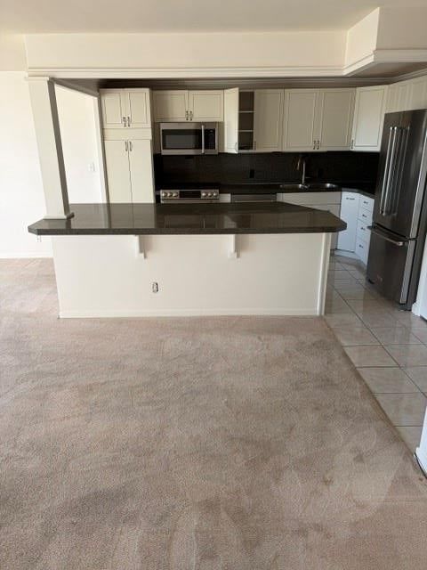 Open floor plan, tile floors and stainless steel appliances at 221 W 48th Street #1505, Kansas City, MO 64112