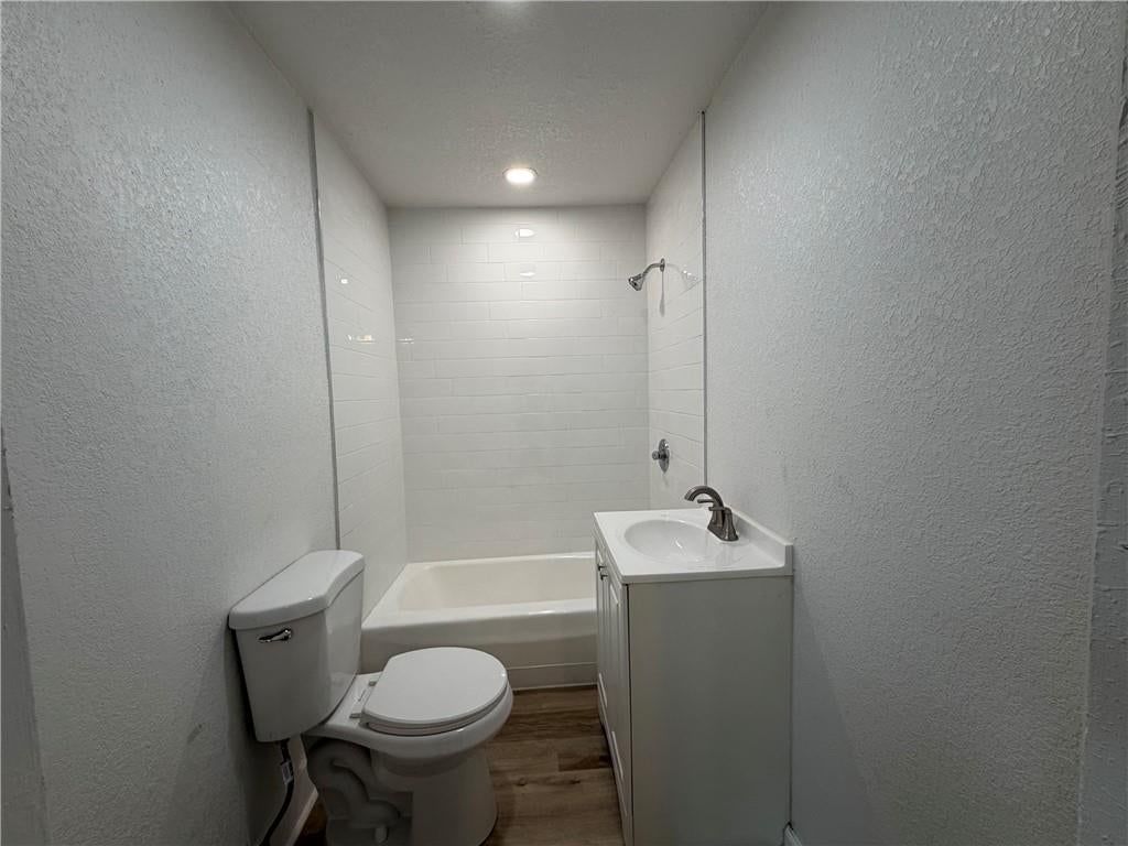 Tiled shower and renovated bathrooms at 5026 E 7th Street, Kansas City, MO 64124