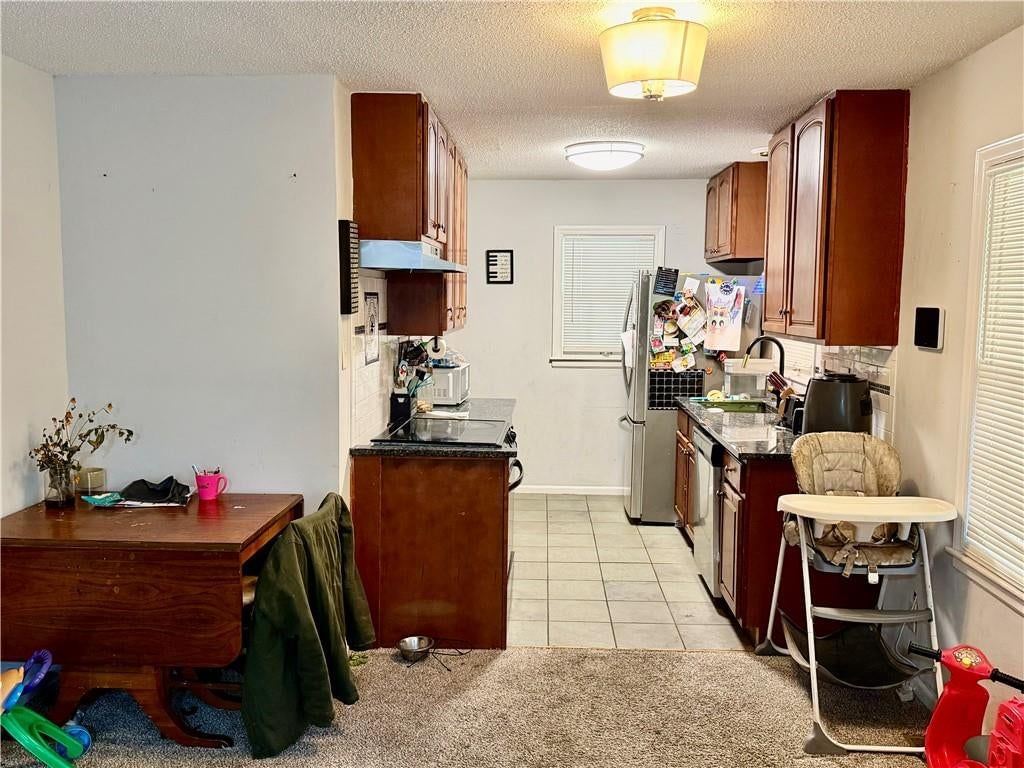 Open floor plan, tile floors and breakfast nook at 10501 E 27th Terrace S, Independence, MO 64052