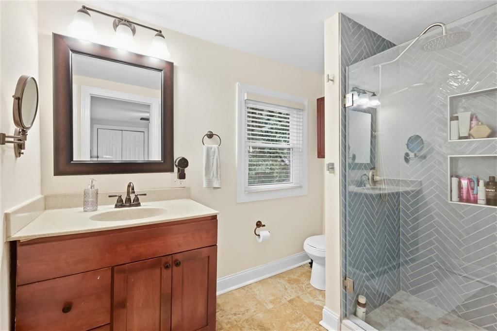 Walk-in shower, tiled shower and frameless glass shower at 5127 Walnut Street, Kansas City, MO 64112