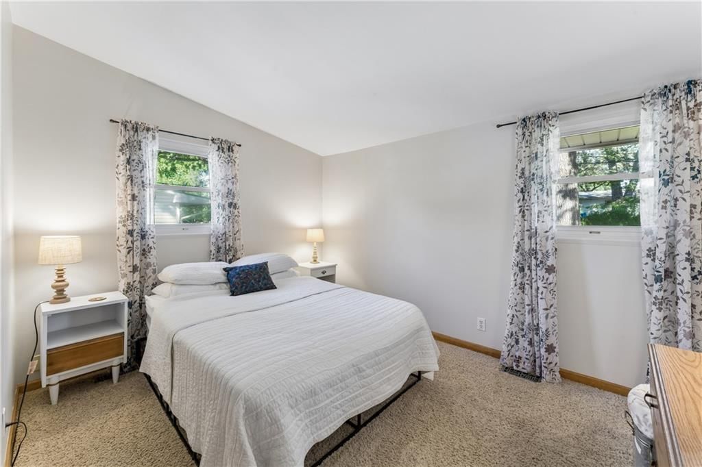 Main-floor primary bedroom at 18510 E 5th Street N, Independence, MO 64056