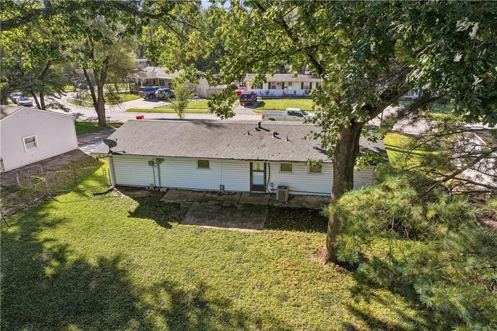 Fenced yard, paver patio and chain-link fence at 18510 E 5th Street N, Independence, MO 64056