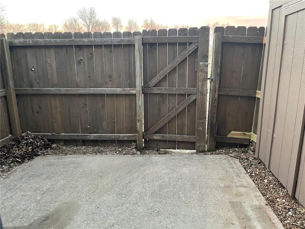 Fenced yard, wood fence and concrete patio at 725 SW Liggett Road #C, Blue Springs, MO 64015