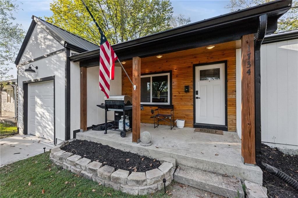 Covered front porch at 1734 Main Street, Osawatomie, KS 66064