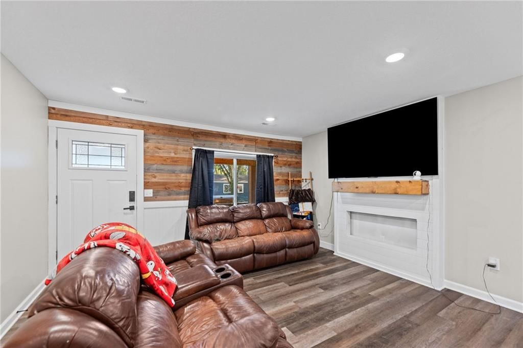 Fireplace, shiplap / paneling and white trim at 1734 Main Street, Osawatomie, KS 66064