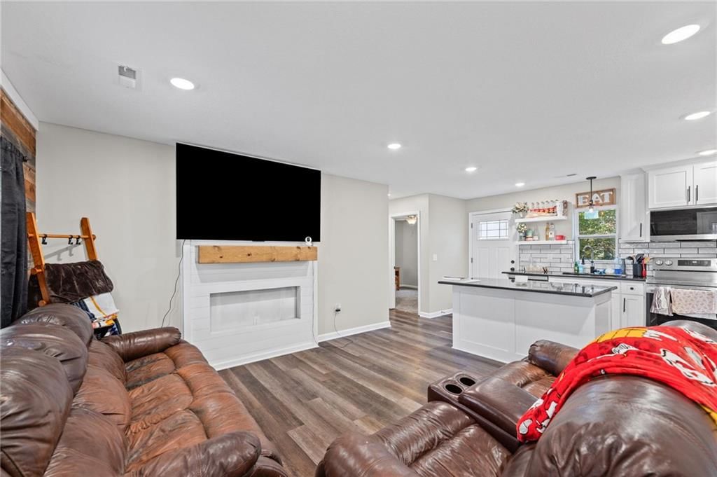 Open floor plan, luxury vinyl floors and recessed lighting at 1734 Main Street, Osawatomie, KS 66064