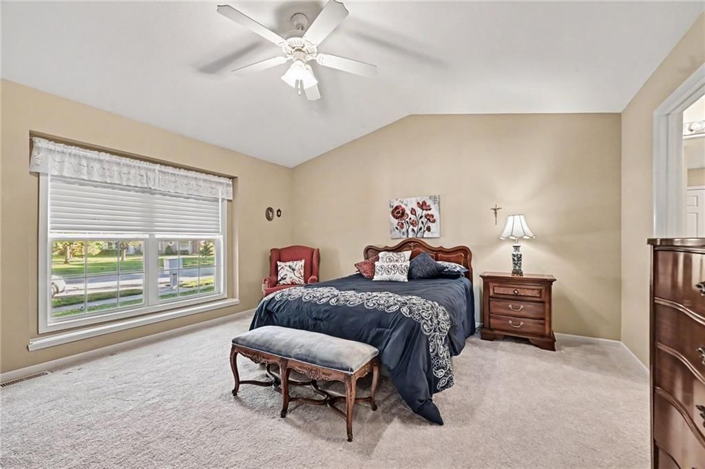 Main-floor primary bedroom and carpet at 15212 S Greenwood #2000 Street, Olathe, KS 66062