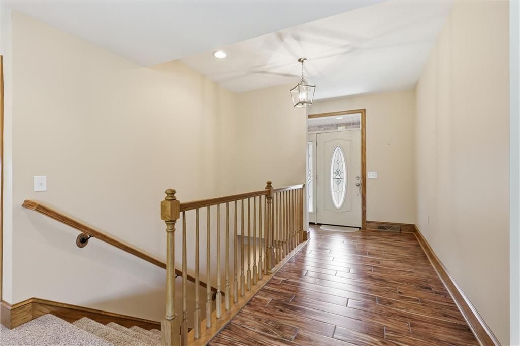 Staircase and wood stair railing at 7000 Fort Myers Boulevard, Belton, MO 64012