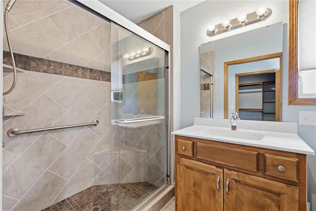 Walk-in shower and tiled shower at 7000 Fort Myers Boulevard, Belton, MO 64012