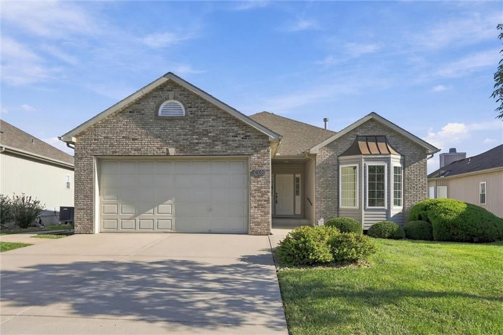 Covered front porch and attached garage at 7600 NE 113th Street, Kansas City, MO 64157
