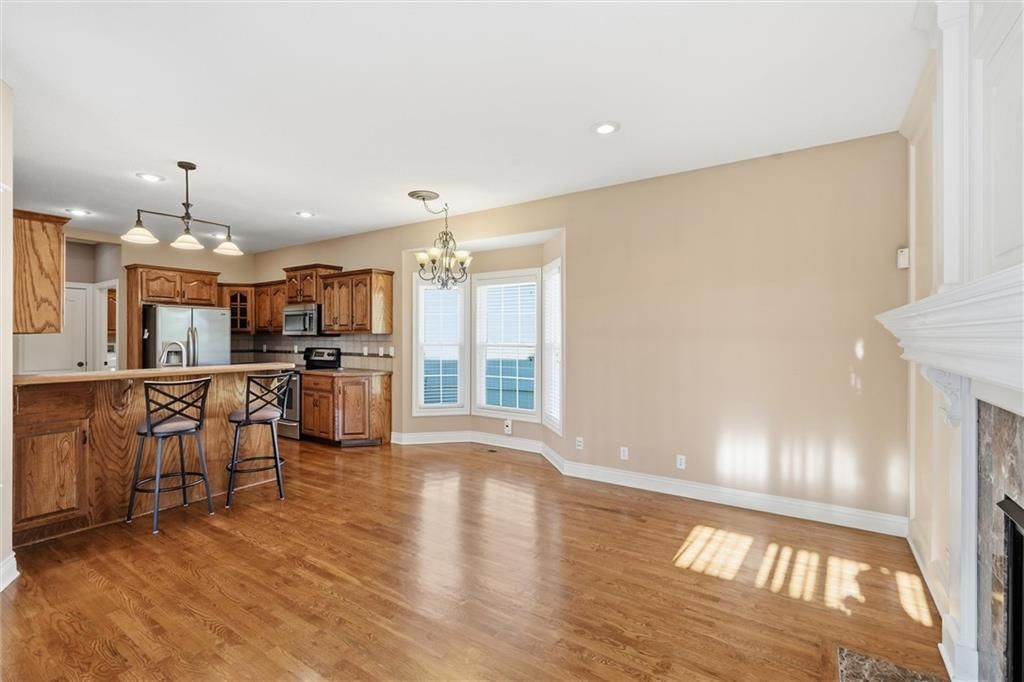 Open floor plan, statement lighting and breakfast nook at 7600 NE 113th Street, Kansas City, MO 64157