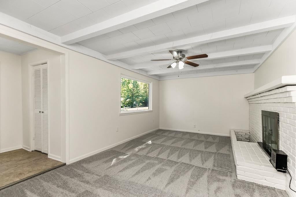 Fireplace and ceiling beams at 16000 Allen Avenue, Belton, MO 64012