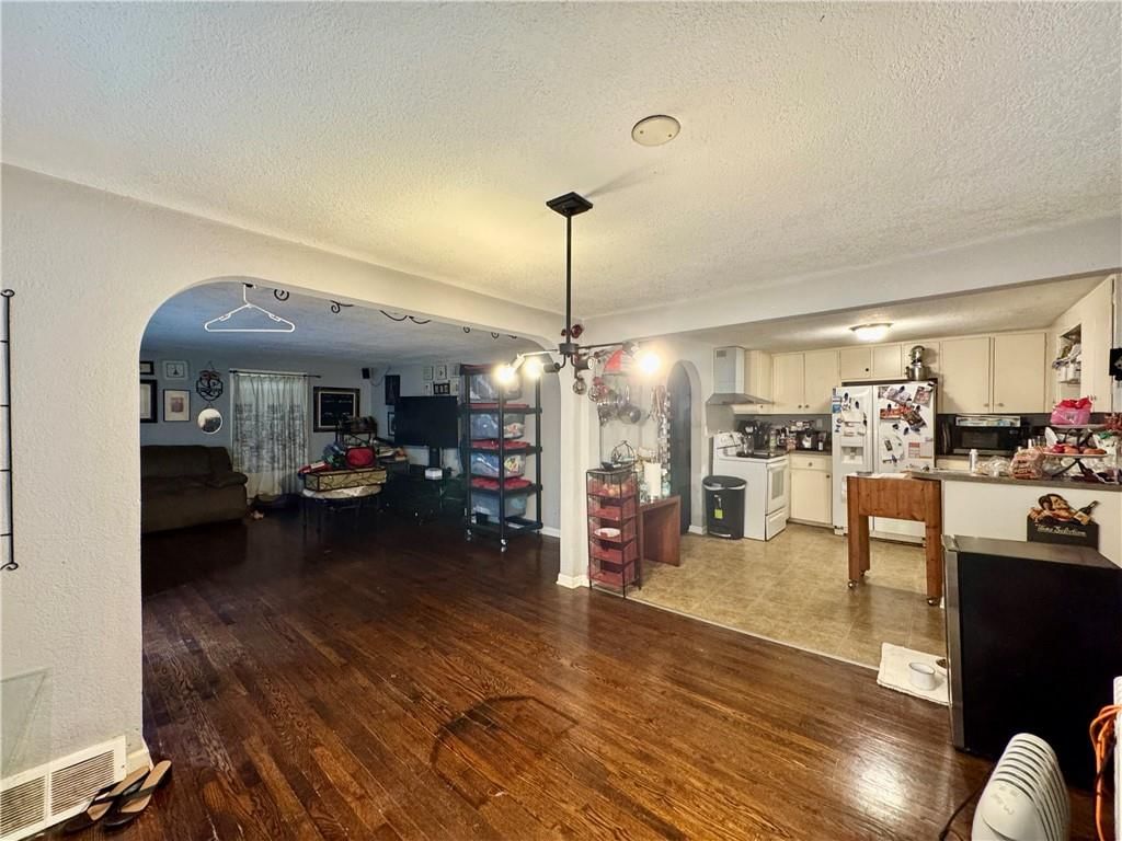Open floor plan and hardwood floors at 10020 W 51st Street, Merriam, KS 66203