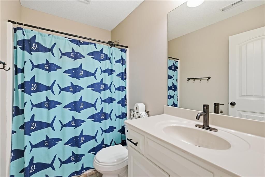 Tiled shower and renovated bathrooms at 16917 Cross Creek Drive, Belton, MO 64012