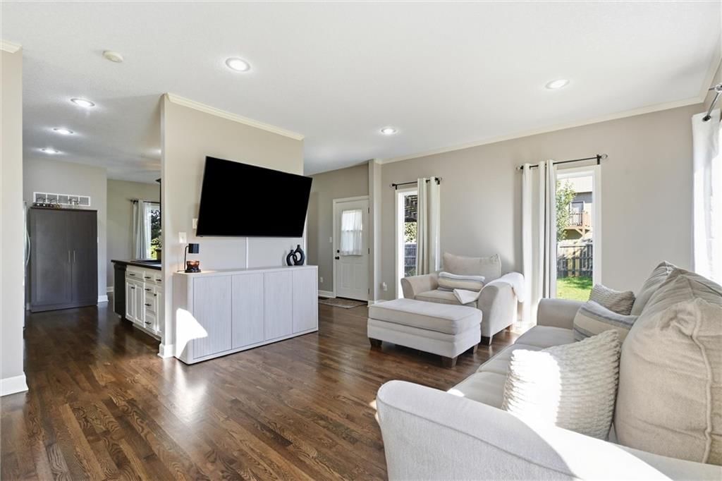 Open floor plan, hardwood floors and recessed lighting at 16917 Cross Creek Drive, Belton, MO 64012