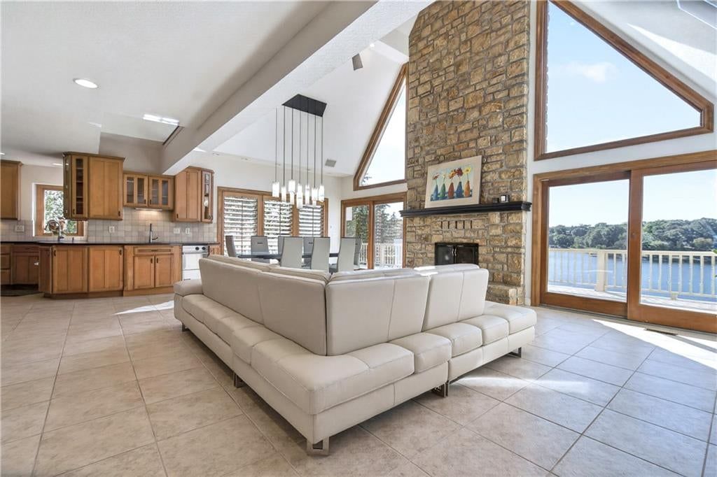 Tall ceilings, open floor plan and floor-to-ceiling windows at 118 NE Edgewater Drive, Lee's Summit, MO 64064