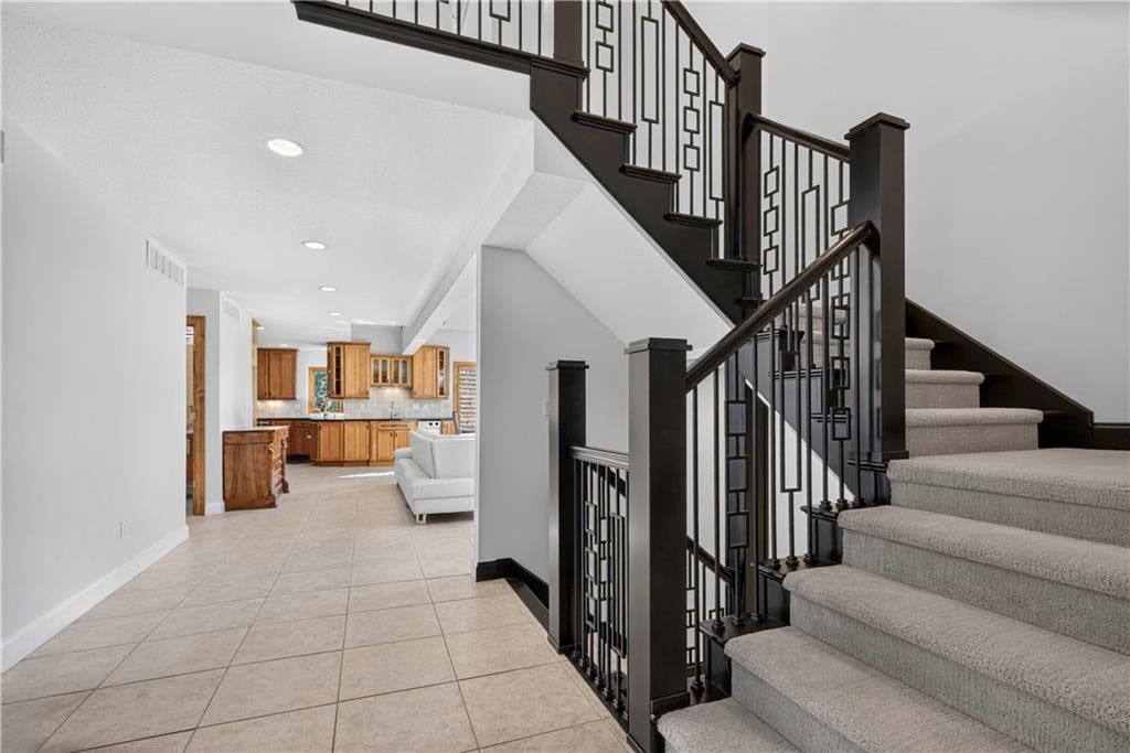Staircase and iron stair railing at 118 NE Edgewater Drive, Lee's Summit, MO 64064