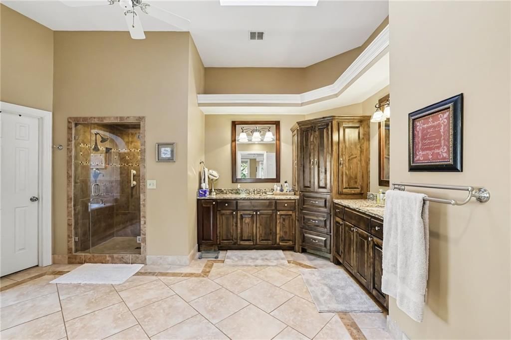 Tile floors, walk-in shower and tiled shower at 14104 Kessler Street, Overland Park, KS 66221