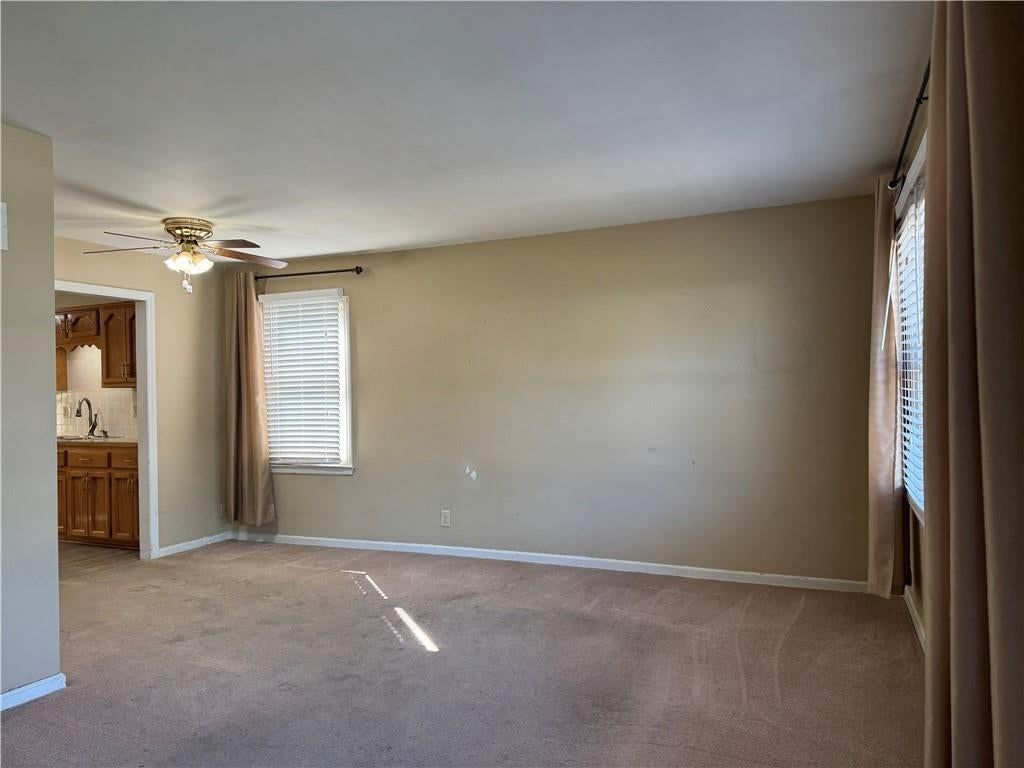 Open floor plan, white trim and beige walls at 1401 NE 67th Terrace, Gladstone, MO 64118