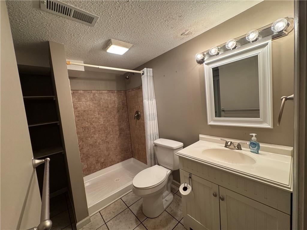 Walk-in shower and tiled shower at 1401 NE 67th Terrace, Gladstone, MO 64118