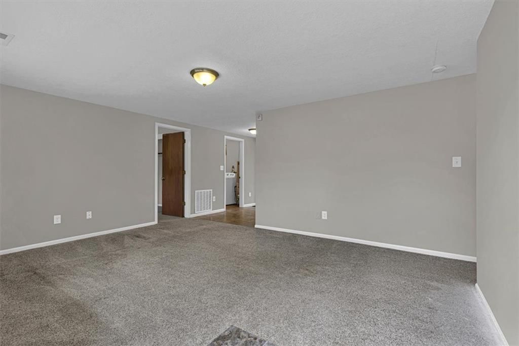White trim and greige walls at 6503 River Road, Pleasant Valley, MO 64068