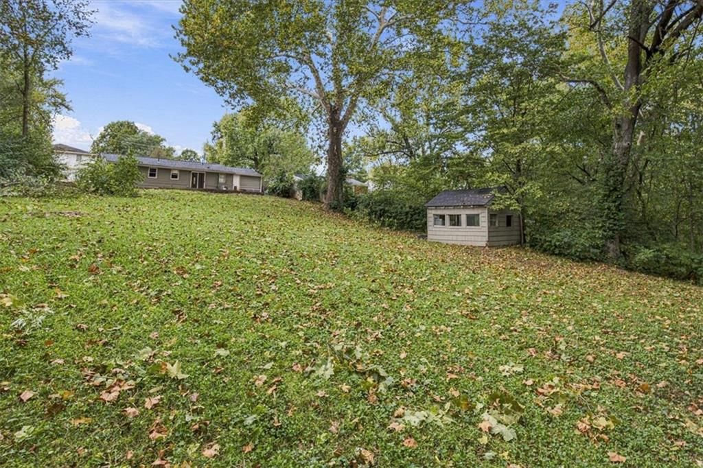 Big backyard, mature trees and flat lot at 6503 River Road, Pleasant Valley, MO 64068