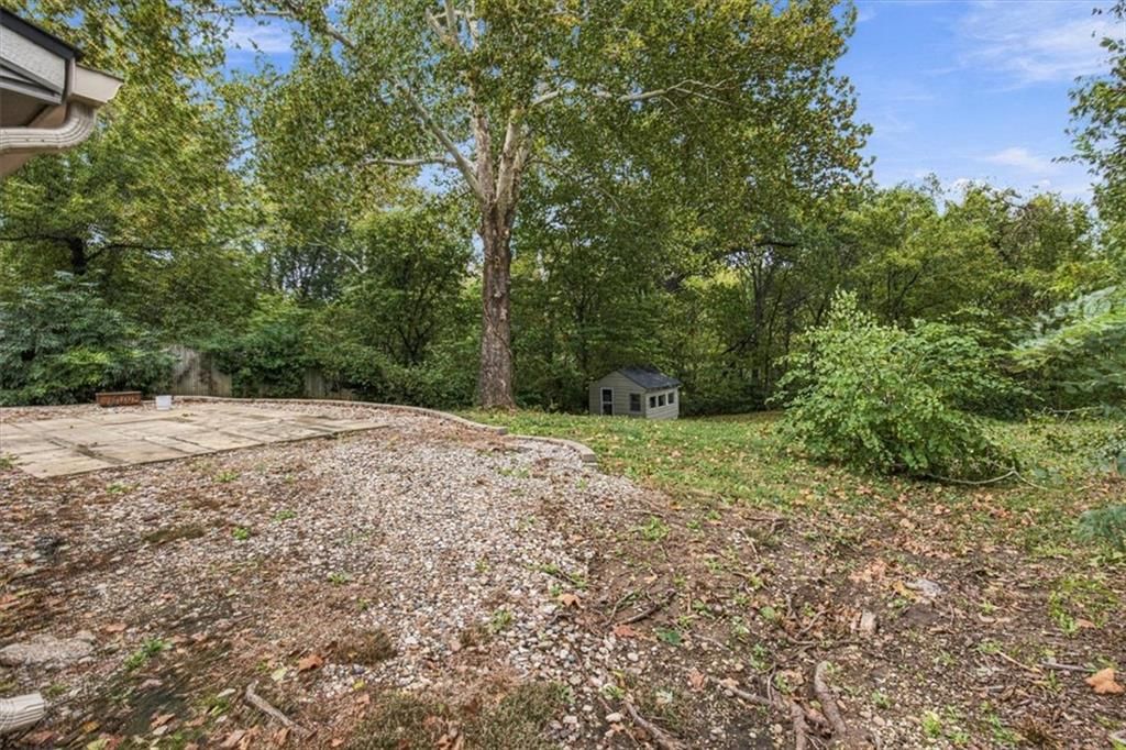 Fenced yard and wood fence at 6503 River Road, Pleasant Valley, MO 64068