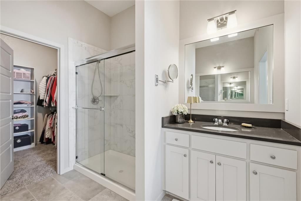 Tile floors, walk-in shower and tiled shower at 21798 W 119th Terrace #1401, Olathe, KS 66061