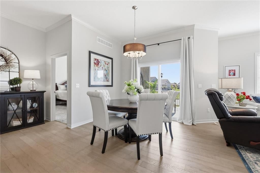 Open floor plan, statement lighting and breakfast nook at 21798 W 119th Terrace #1401, Olathe, KS 66061