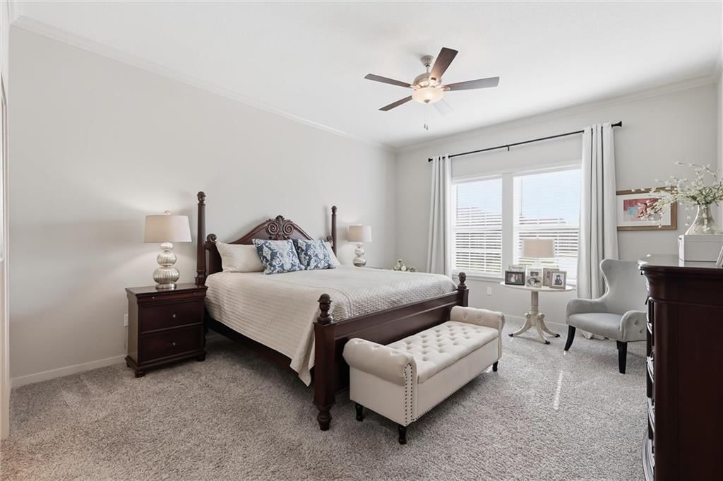 Main-floor primary bedroom and carpet at 21798 W 119th Terrace #1401, Olathe, KS 66061