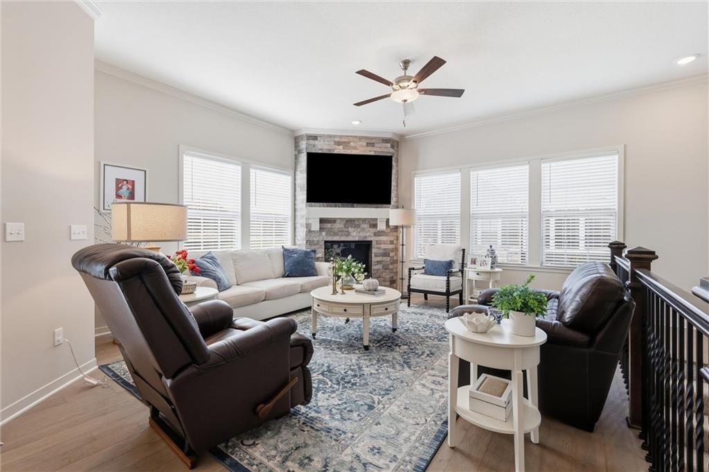 Fireplace, hardwood floors and stone fireplace at 21798 W 119th Terrace #1401, Olathe, KS 66061