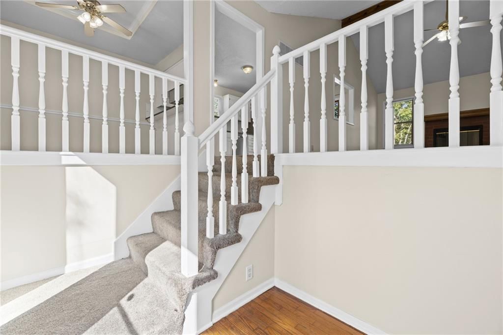 Fenced yard, staircase and wood stair railing at 1558 W Mulberry Street, Olathe, KS 66061
