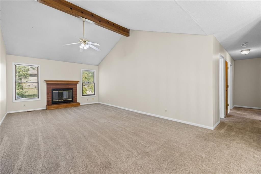 Fireplace and ceiling beams at 1558 W Mulberry Street, Olathe, KS 66061
