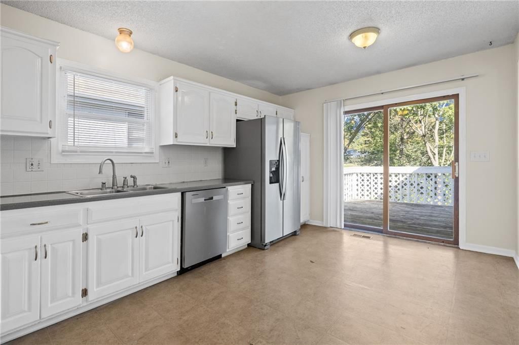 White kitchen, kitchen backsplash and subway tile backsplash at 1558 W Mulberry Street, Olathe, KS 66061