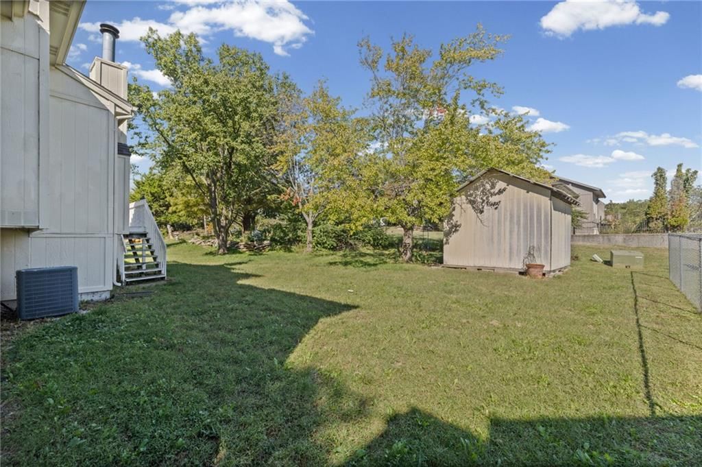 Corner lot, mature trees and flat lot at 1558 W Mulberry Street, Olathe, KS 66061