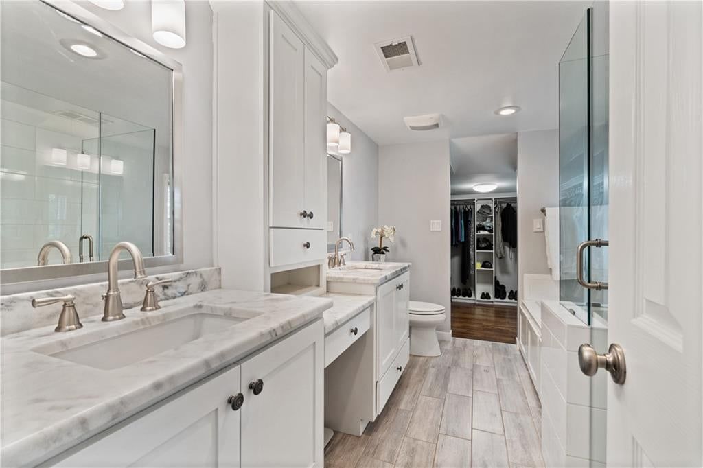 Walk-in shower, tiled shower and double vanity at 5307 Aberdeen Road, Fairway, KS 66205