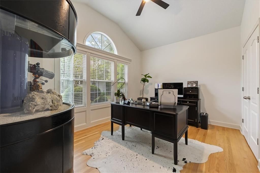 Hardwood floors, home office and black hardware at 13725 Pembroke Circle, Leawood, KS 66224